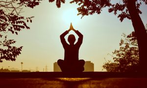 lady practicing yoga to relax herself